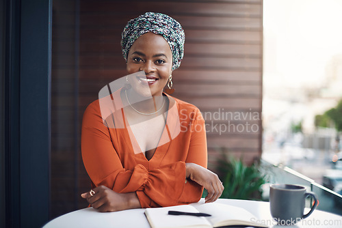 Image of Im here for success. Cropped portrait of an attractive businesswoman working at a desk in her office.
