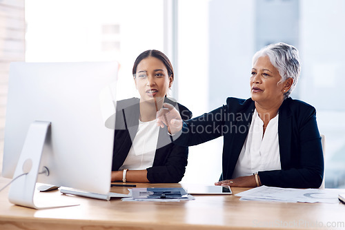 Image of Mentor, training or business women with computer talking, speaking or planning a project in office. Technology, teamwork collaboration or senior manager explaining to an intern for digital coaching