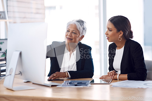 Image of Mentor, coaching or business women with computer talking, speaking or planning a project in office. Technology, teamwork collaboration or senior manager explaining to an intern for digital training