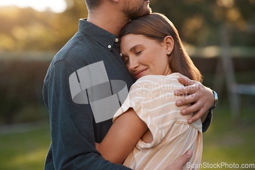 Image of I want to be close to your heart at all times. Shot of an affectionate couple spending the day outdoors.