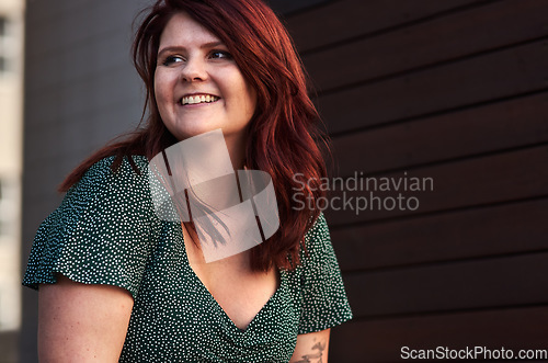 Image of Red hair is like a crown you never take off. Cropped shot of a beautiful young woman posing outdoors.