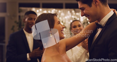 Image of Im already loving being married to you. Cropped shot of an affectionate young newlywed couple dancing in front of their guests at their wedding reception.