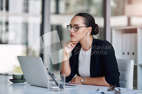 Image of Keep working hard until you achieve your goals. Cropped shot of an attractive young businesswoman working on a laptop inside her office.