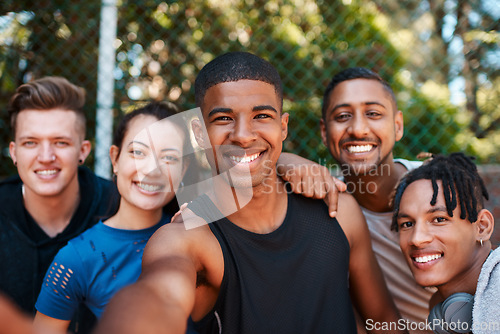 Image of Staying active automatically makes you happier too. Portrait of a group of sporty young people taking selfies together outdoors.