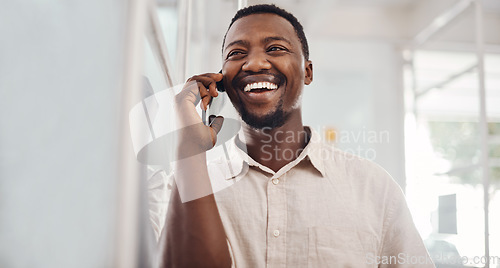 Image of Yes, thats a deal. Shot of a young businessman talking on a cellphone in an office.