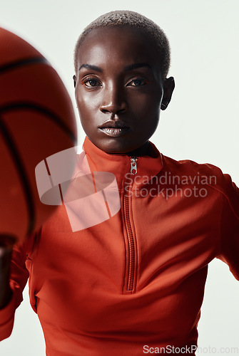 Image of Prepare to feel intimidated. Studio shot of an attractive young woman playing basketball against a grey background.