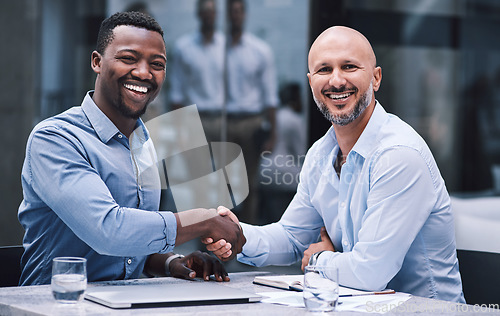 Image of You never know where you connections could take you. Shot of two businessmen shaking hands during a meeting.