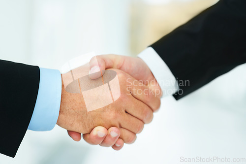 Image of Down to business. Cropped shot of two businessmen shaking hands.