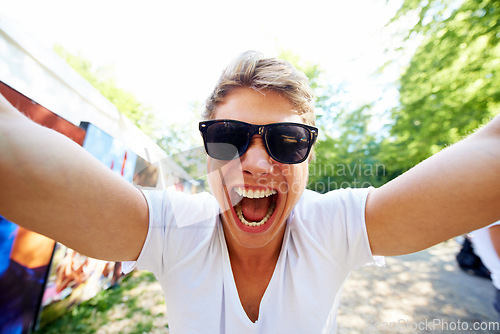 Image of This is gonna be AMAZING. Portrait of a young man shouting at the camera in excitement.