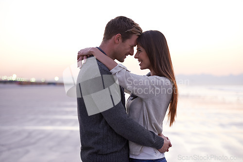 Image of Theres nothing like young love. A young couple enjoying a romantic moment together at the beach.