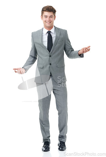 Image of Success comes naturally to this businessman. A handsome young businessman isolated on white.