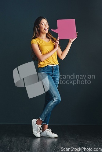 Image of Perhaps its time to make our voice heard. Studio shot of a beautiful young woman holding a speech bubble.