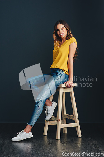 Image of I enjoy the simple things in life. Studio shot of an attractive young woman against a dark background.