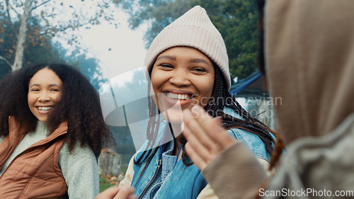 Image of Camping, laughing and friends in conversation in nature on winter weekend trip or holiday. High five, celebration and women talking and making funny jokes together in a forest on an outdoor vacation.