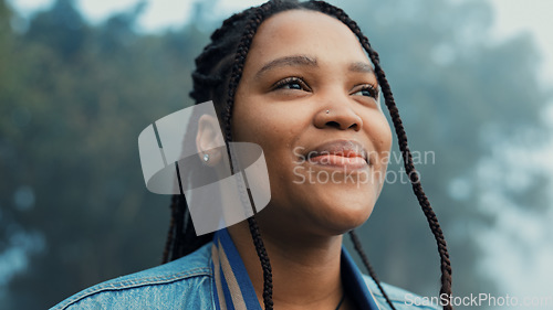 Image of Face, thinking and a happy woman outdoor in nature to relax and breath fresh air to relax. Vacation, calm woods and closeup of a young african girl on a holiday or hike on misty morning with a smile