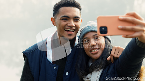 Image of Selfie, travel and a couple hiking in nature together for adventure, fun or to explore the wilderness. Photograph, love and young people bonding while posing for a profile picture on social media