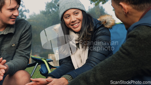 Image of Wood, fire and warm hands on camping, trip or adventure in nature, forest or friends together at a bonfire in winter. Campfire, smoke and group relax on outdoor vacation, holiday or warming hand