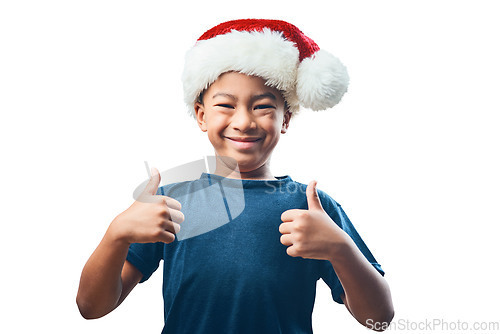 Image of Happy boy, portrait smile and Christmas with thumbs up for success isolated on a transparent PNG background. Face of child, kid or teen smiling with thumb emoji, yes sign or like and festive hat