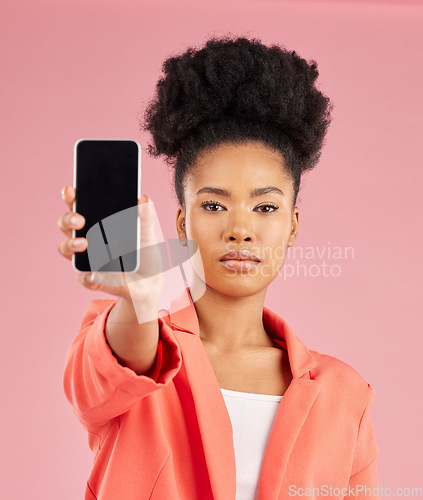 Image of Portrait of black woman, phone and screen in studio for contact info, website promo or social media. Cellphone, mobile app and model on pink background with online news announcement, offer or deal.