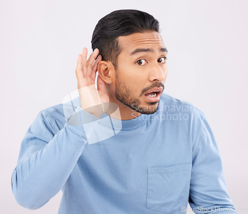 Image of Ear, hands and portrait of asian man with listen, whisper or hearing secret, gossip or news on white background in studio. Confused, what and guy face with emoji for deaf, speak up or volume gesture