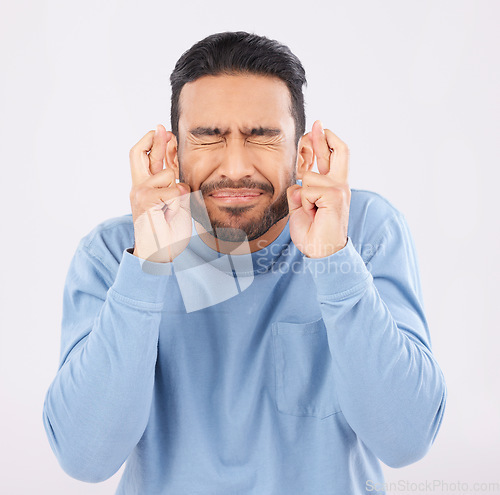 Image of Hope, fingers crossed and asian man in studio with good luck sign for bonus, prize or giveaway on grey background. Eyes closed, wish and Japanese male with emoji for waiting, reward or lotto results