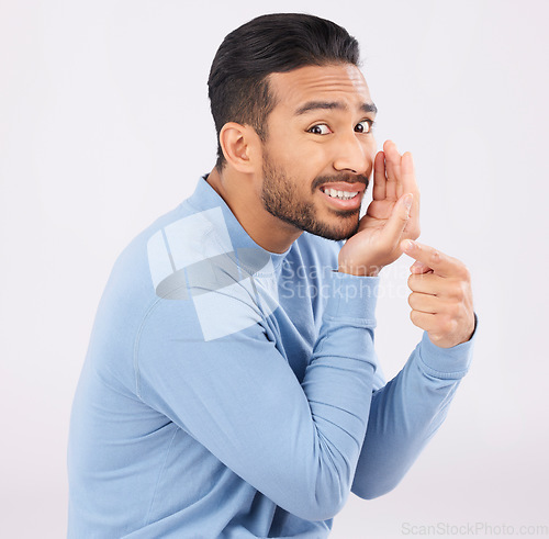 Image of Hand pointing, whisper and portrait of asian man in studio with secret, drama or rumor on grey background. Face, gossip and Japanese guy with bullying sign, body language or confidential sneaky news