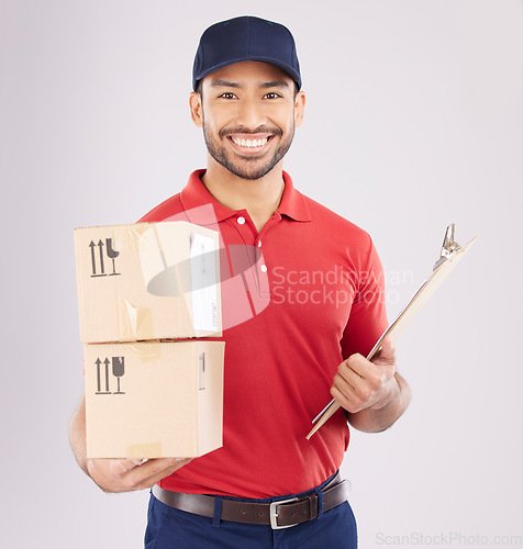 Image of Happy asian man, portrait and box for courier service, delivery and clipboard for checklist against a grey studio background. Male person smile in supply chain with parcel or package for logistics