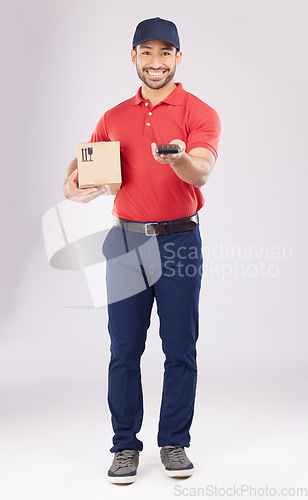 Image of Asian man, portrait and box with pos for payment, delivery or ecommerce against a grey studio background. Male person smile in supply chain, logistics or courier service with package and card machine