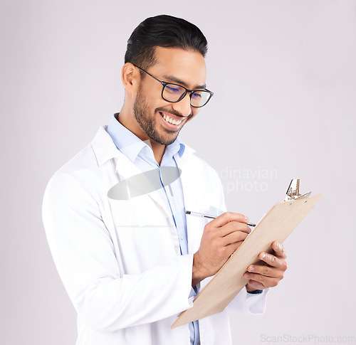 Image of Happy man, doctor and writing on clipboard in studio, planning documents and healthcare schedule. Asian medical worker with report of insurance checklist, medicine notes or script on white background