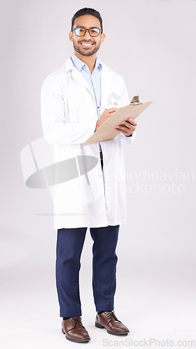 Image of Portrait, asian man and doctor in studio with clipboard, documents or healthcare administration. Happy medical worker writing report of insurance checklist, test results or script on white background
