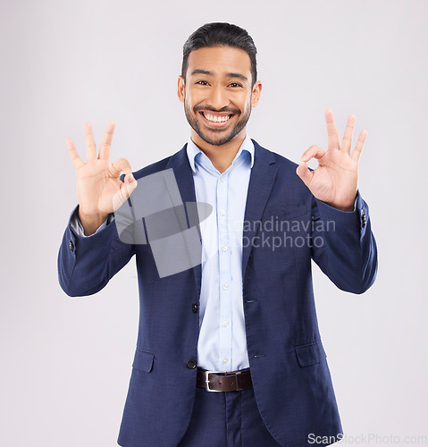 Image of Happy, portrait and asian man with perfect sign in studio for support, agree or feedback, thank you or review on grey background. Smile, face and emoji okay gesture by male with approval, like or yes