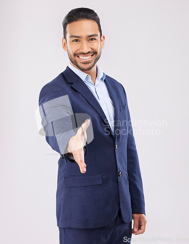 Image of Happy businessman, portrait and handshake for introduction, greeting or meeting against a grey studio background. Asian man shaking hands for business opportunity, hiring or deal in team agreement