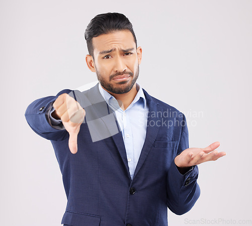 Image of Studio portrait, thumbs down and business man with negative fail sign, no opinion vote or decision disagreement. Emoji gesture, problem and corporate person with bad feedback news on white background