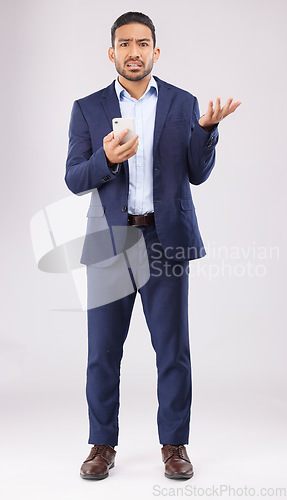 Image of Phone, crisis and asian man portrait in studio confused with scam, alert or internet glitch on grey background. Stress, smartphone and online problem for Japanese guy angry by spam, phishing or 404