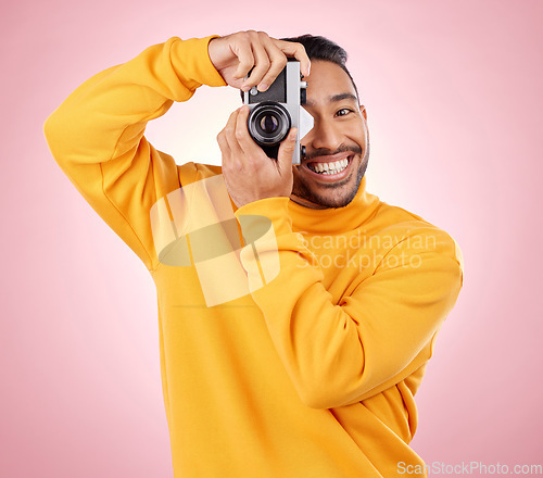 Image of Portrait, man with a camera and smile for photography, taking a picture for art, travel or record of a happy memory. Creative photographer, happiness and shooting on retro or vintage film technology