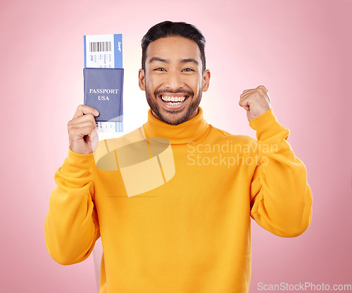 Image of Happy asian man, portrait and passport with ticket for travel, winning or success against a pink studio background. Male person smile, documents or fist pump for flight discount, sale or holiday trip