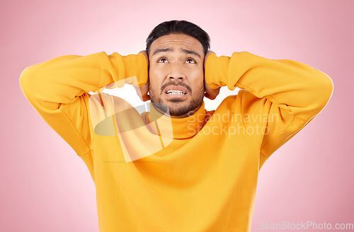 Image of Headache, stress and asian man in studio with depression, tinnitus or brain fog on pink background. Anxiety, migraine and Japanese guy in crisis, mistake or fail, vertigo or frustrated by noise