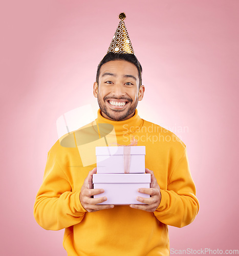 Image of Man, portrait and present for birthday party, prize and giveaway celebration or success on pink background. Excited asian person or winner with gift boxes for retail competition or sale in studio