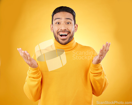 Image of Excited, surprise and portrait of man with wow face, emoji or facial expression for joy isolated in a yellow studio background. Casual, happy and friendly young male person with smile reaction