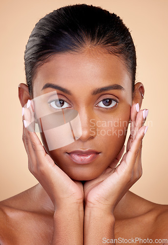 Image of Portrait, skincare and beauty with indian girl for dermatology with glow in brown studio background. Natural, face and healthy skin with cosmetics or spa treatment for self care in mock up for shine.