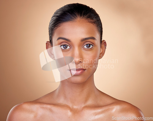 Image of Portrait, skincare and woman with natural beauty, cosmetics and dermatology on a brown studio background. Face, female person or model with makeup, shine and glow with luxury, self care and aesthetic