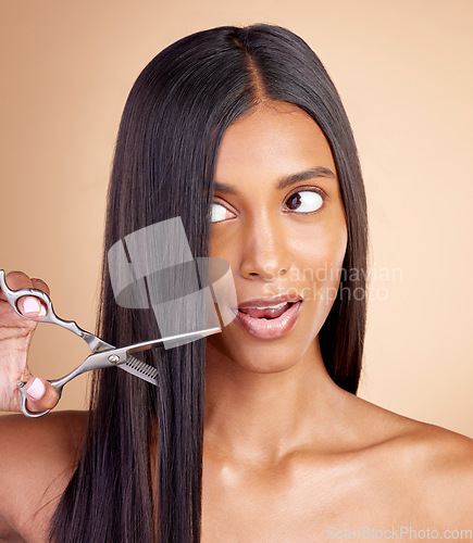 Image of Cutting, hair care or Indian woman with scissors for beauty or self care for grooming on brown background. Transformation, studio or girl in salon with tools or cosmetics gear for haircut treatment