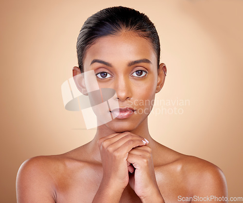 Image of Portrait, skincare and indian girl with glow or beauty in studio background for dermatology. Natural, face and woman with healthy skin for cosmetics or self care, spa treatment in mock up or facial.