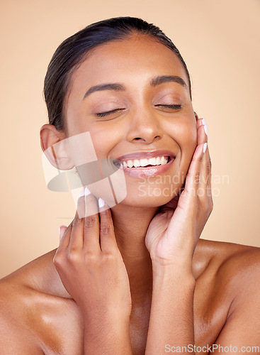 Image of Face, skincare or happy woman with natural beauty or facial glow with dermatology cosmetics in studio. Eyes closed, relax or beautiful Indian girl model laughing with wellness, smile or self love