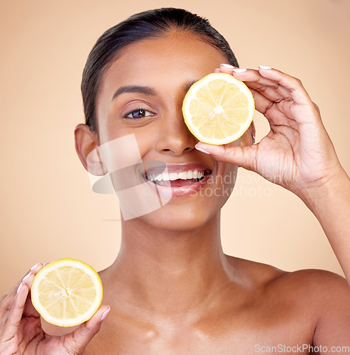 Image of Lemon, portrait ad natural skincare of woman in studio for vitamin c benefits, eco cosmetics and nutrition. Face of indian female model, healthy beauty or citrus fruit for aesthetic vegan dermatology