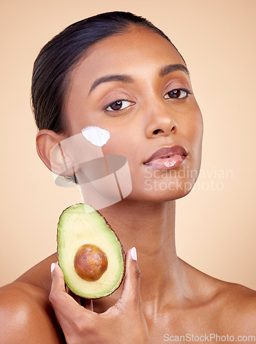 Image of Avocado, cream and skincare with portrait of woman in studio for product, beauty and natural cosmetics. Spa, facial and lotion with face of model on brown background for vitamin c and self care