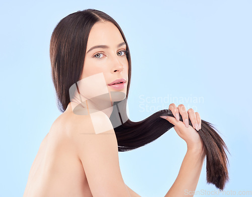 Image of Hair, face and beauty, woman and cosmetology with keratin treatment isolated on blue background. Female model, haircare and salon hairstyle, Brazilian shine and growth with portrait in a studio