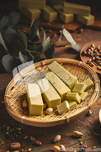 Image of White chocolate cubes with pistachios