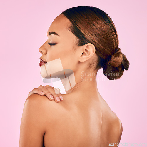 Image of Woman, face and profile, natural beauty and skincare with cosmetic shine isolated on pink background. Female model, calm with makeup and dermatology, skin glow and wellness with self love in studio