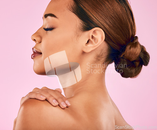 Image of Face, profile and beauty, woman and skincare with natural cosmetics and shine isolated on pink background. Female model, health skin glow and dermatology with wellness, self love and makeup in studio
